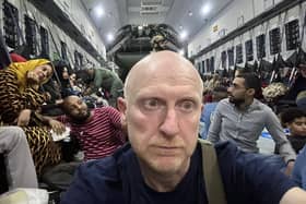 Derr man Brian McDaid onboard the Spanish aircraft outside Khartoum.