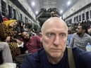 Derr man Brian McDaid onboard the Spanish aircraft outside Khartoum.