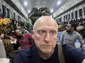 Derr man Brian McDaid onboard the Spanish aircraft outside Khartoum.