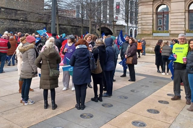 Teachers and health workers form up in Guildhall Square.