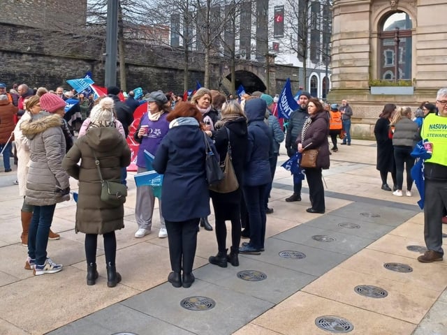 Teachers and health workers form up in Guildhall Square.