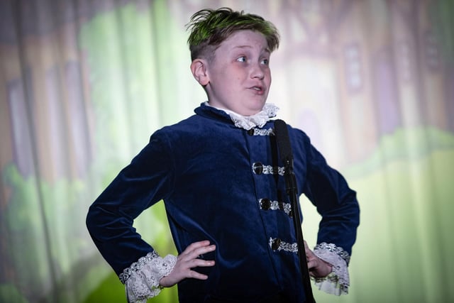 The energetic George McCarron as 'Buttons' on stage at Steelstown's PS production of 'Cinderella Rockerfella.'
