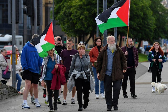 People gather for a Vigil for Gaza held on the Peace Bridge on Friday Evening, organised by the Derry Irish Palestinian Solidarity Campaign. Photo: George Sweeney