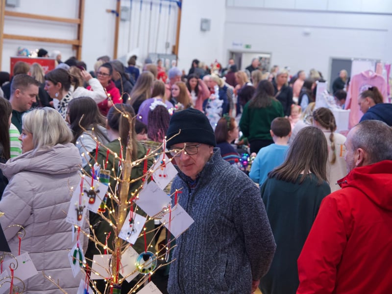 People enjoying the St. Mary's College Christmas Fair.