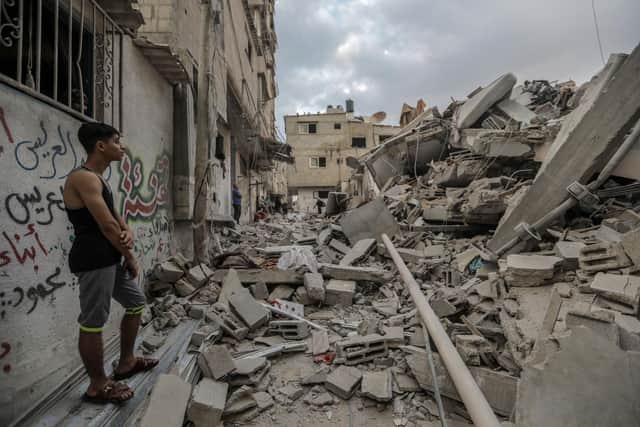 People search through buildings, destroyed during Israeli air strikes a day earlier,  in the southern Gaza Strip on November 14, 2023 in Khan Yunis, Gaza. (Photo by Ahmad Hasaballah/Getty Images)