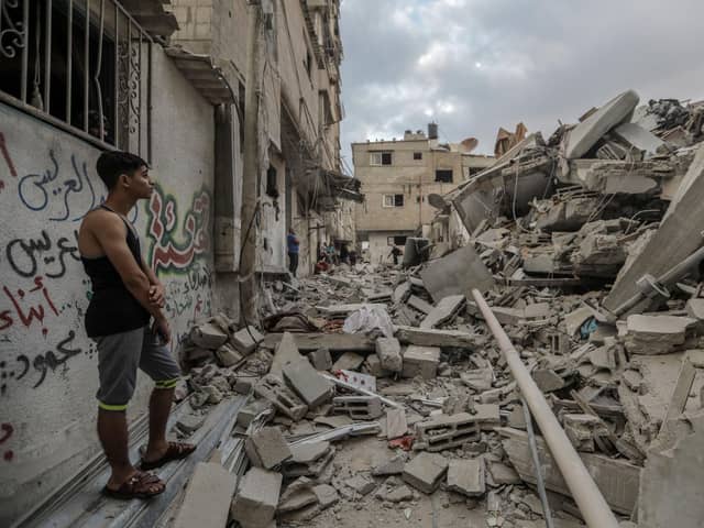 People search through buildings, destroyed during Israeli air strikes a day earlier,  in the southern Gaza Strip on November 14, 2023 in Khan Yunis, Gaza. (Photo by Ahmad Hasaballah/Getty Images)
