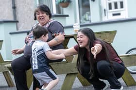 Aunt Orlaith Casey gives a big hug to nephew Daniel James after his superb dancing at Wednesday's Tea Party.  : .