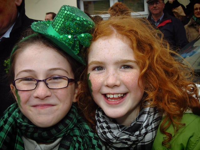 Hannah McLaughlin, left, and Rosaleen McGeehan enjoy the St Patrick's Day fun in Moville. (1903PG21)