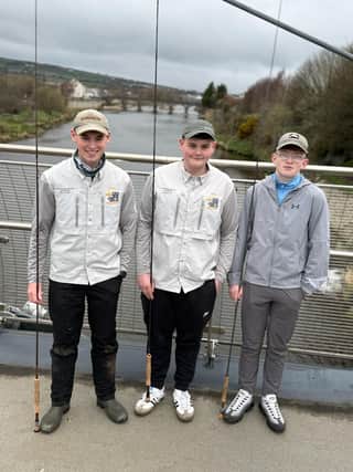 The three local anglers who have qualified to represent Ireland at the World Fly Tying Championships in Idaho, USA, from left Jacob Griffin, Zack Barnett and Lewis Porter standing on the River Mourne where the North West Angling Fair will take place this weekend.
