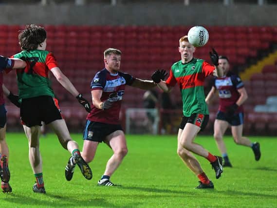 Ciaran O’Brien of Glack battles with Doire Trasna’s Daniel O’Doherty during Friday evening’s JFC quarter-final in Celtic Park. Photo: George Sweeney