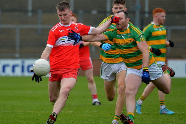 Drumsurn captain Tiernan Woods holds off Glenullin’s John O’Kane during the Derry IFC final in Celtic Part on Sunday afternoon last. Photo: George Sweeney.  DER2243GS – 038
