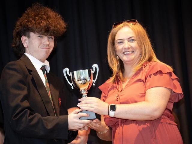 Ms. Carla Hagan, Head of Year presenting the award for GCSE Politics to Jayden Nixon on Thursday last.