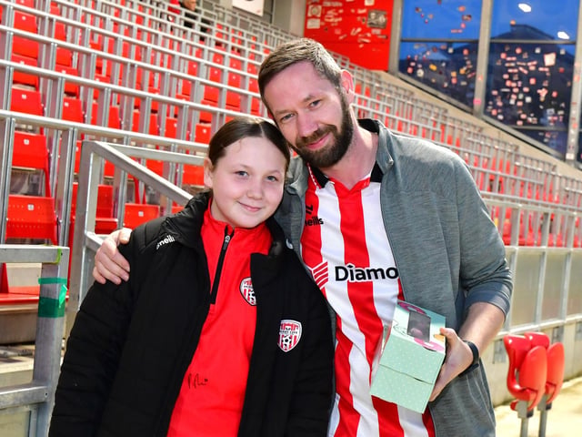 These two Derry fans smile for our camerman.