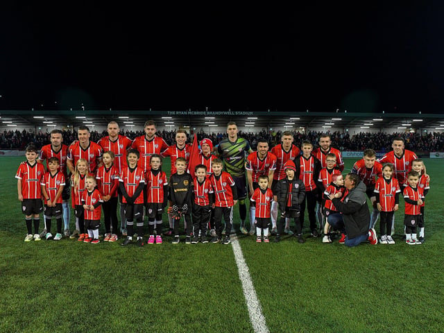 Mascots pictured with Derry City’s starting eleven against St Patrick’s Athletic at the Brandywell on Friday evening. Photograph: George Sweeney