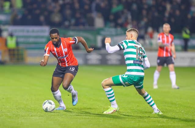 Sadou Diallo, back from suspension for this game, moves away from Shamrock Rovers midfielder Markus Poom. Photograph by Kevin Moore.