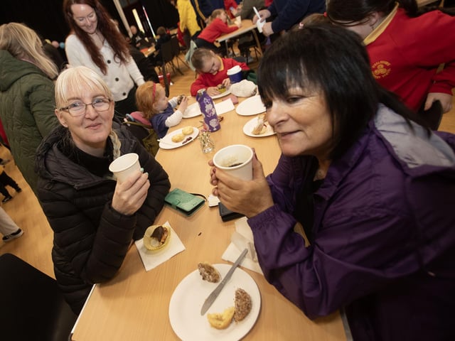 Mums Charlene McBrearty and Ann Nixon enjoying a quick coffee on Friday at Steelstown PS.