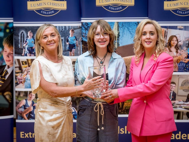 Mrs Siobhan Matthewson and Mrs Léan Mc Shane (Senior Teacher) presenting the Business Eye Award to Ava Mc Cloone.