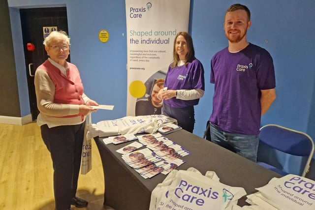 Helen Bradley from Glenbrook House learns more about Praxis Care, one of the organisations with an information stand at the event