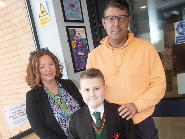 Senior teacher Mrs. Mary Jo Shiels pictured with Year 8 student Jamie McFadden and his dad Alan on Monday. : St. Joseph's Boys School welcomes latest influx of Year 8 pupils