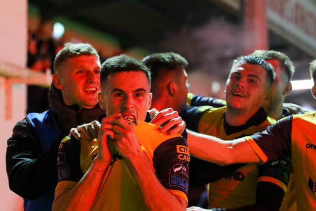 Jordan McEneff kisses the Derry badge after scoring in the first half against St Patrick's Athletic at Richmond Park. Photo by Kevin Moore.