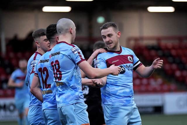 Mikhail Kennedy is congratulated by Institute players after his first goal against Ballyclare Comrades. Photograph: George Sweeney