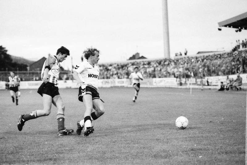 Peter Hutton shepherds a Spurs attacker away from the Derry goal.