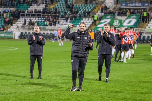 Ruaidhri Higgins celebrates the win in front of the travelling Derry City support alongside assistant boss Alan Reynolds and first team coach Conor Loughery at Tallaght. Photograph by Kevin Moore.