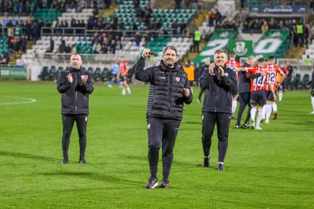 Ruaidhri Higgins celebrates the win in front of the travelling Derry City support alongside assistant boss Alan Reynolds and first team coach Conor Loughery at Tallaght. Photograph by Kevin Moore.