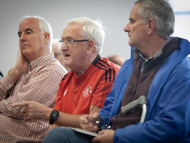 Martin Gallagher poses a question to Brian Dougherty at Monday's event. : .