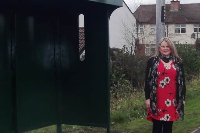 Sinn Féin Councilllor Sandra Duffy at one the bus stops.