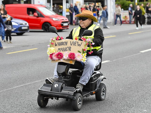 Muff Feile opening parade makes its way through the village on Friday evening. Photo: George Sweeney