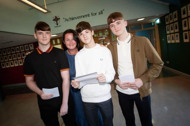 TRIPLE GLORY. . . .Mum Kelly Derges-Bonner pictured with sons Niall, Paudric and Conor after the three got their results at St. Joseph's Boys School on Thursday. (Photo: Jim McCafferty Photography)