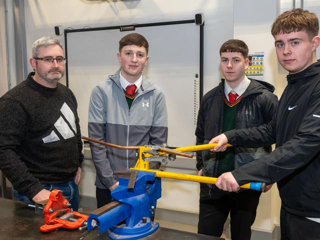 Aidan Cruickshank from St Patrick's and St Brigid's Claudy, Andrew Ryan Cregan and Eddie McGonigle from St Joseph's Boys School, with plumbing lecturer Gary Campbell at the NWRC Open Day and Springtown Campus.