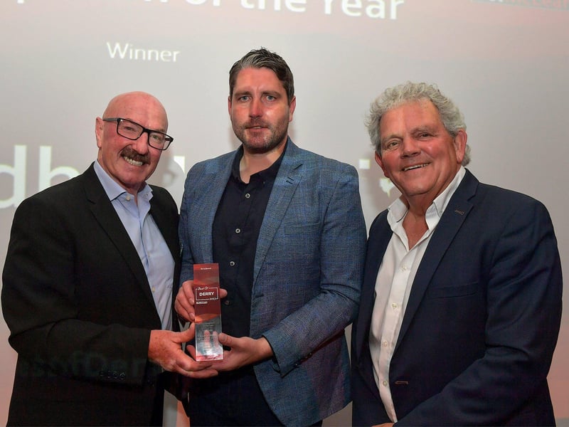 Sports Person of the Year Award winner Ruaidhri Higgins, manager of Derry City Football Club, receives his trophy from soccer pundit Liam Beckett, on the left, and compere Adrian Logan.  Photo: George Sweeney. DER2325GS – 56
