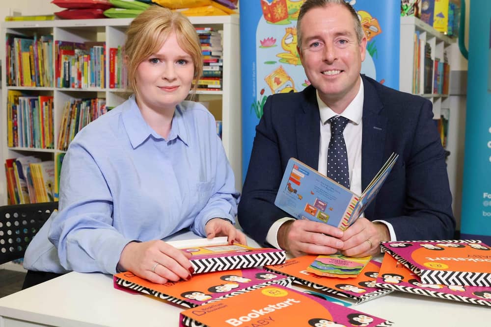 Kathryn Anderson, BookTrust’s Senior Partnerships Manager for Northern Ireland and Education Minister Paul Givan talking about Bookstart Baby packs.