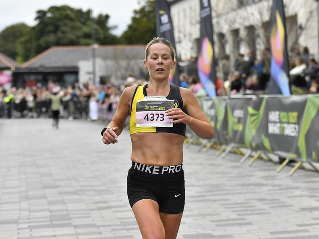 Claire McGuigan, Strabane AC, completes the 2025 Waterside Half Marathon in a time of 1:20:56. Photo: George Sweeney