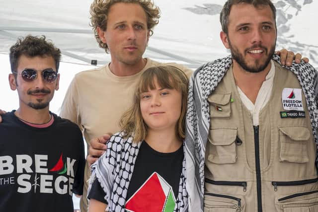 CATANIA, ITALY - JUNE 01: Greta Thunberg with part of the crew of the ship Madleen, shortly before departure for Gaza, during the press conference in San Giovanni Li Cuti on June 01, 2025 in Catania, Italy. Swedish activist Greta Thunberg is among those who will attempt to sail to Gaza on a boat organized by the Freedom Flotilla Coalition (FFC), in a bid to break Israel's blockade of the Palestinian territory. Freedom Flotilla had to abort a previous journey in early May after it said its boat came under attack by drones in international waters near Malta. (Photo by Fabrizio Villa/Getty Images)
