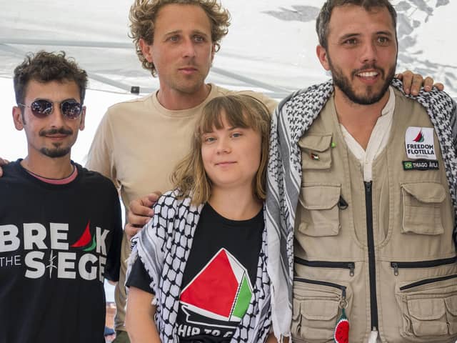 CATANIA, ITALY - JUNE 01: Greta Thunberg with part of the crew of the ship Madleen, shortly before departure for Gaza, during the press conference in San Giovanni Li Cuti on June 01, 2025 in Catania, Italy. Swedish activist Greta Thunberg is among those who will attempt to sail to Gaza on a boat organized by the Freedom Flotilla Coalition (FFC), in a bid to break Israel's blockade of the Palestinian territory. Freedom Flotilla had to abort a previous journey in early May after it said its boat came under attack by drones in international waters near Malta. (Photo by Fabrizio Villa/Getty Images)