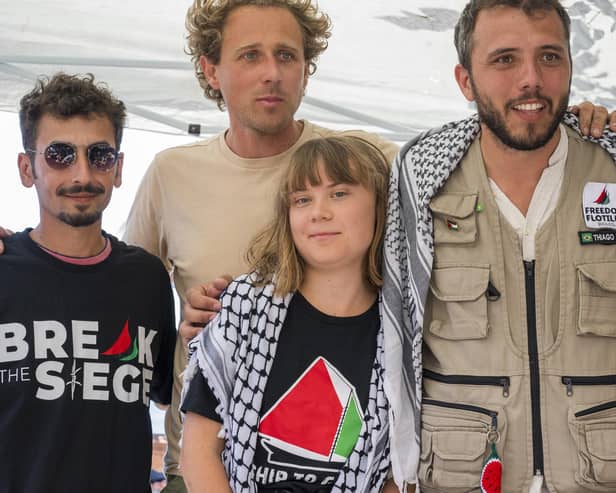 CATANIA, ITALY - JUNE 01: Greta Thunberg with part of the crew of the ship Madleen, shortly before departure for Gaza, during the press conference in San Giovanni Li Cuti on June 01, 2025 in Catania, Italy. Swedish activist Greta Thunberg is among those who will attempt to sail to Gaza on a boat organized by the Freedom Flotilla Coalition (FFC), in a bid to break Israel's blockade of the Palestinian territory. Freedom Flotilla had to abort a previous journey in early May after it said its boat came under attack by drones in international waters near Malta. (Photo by Fabrizio Villa/Getty Images)