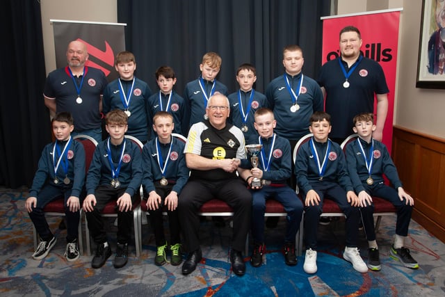 Joe Doherty, IFA Senior Coach, presenting the Under 12 Championship Summer Cup to Clooney FC at the Annual Awards in the City Hotel on Friday night last. Included are coaches Ally Colhoun and Thomas Nelson. (Photo:  Jim McCafferty)