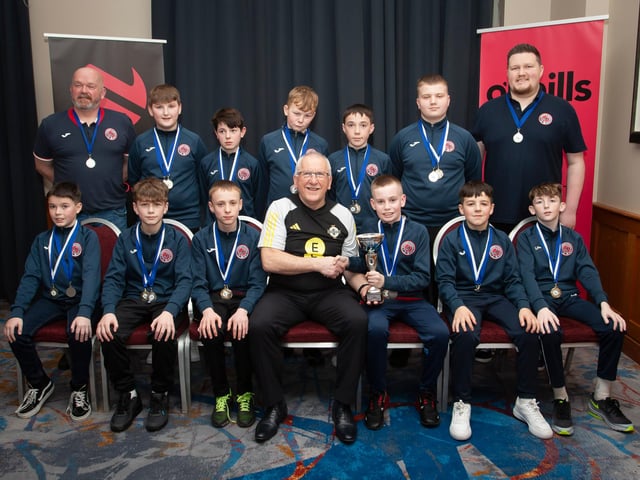 Joe Doherty, IFA Senior Coach, presenting the Under 12 Championship Summer Cup to Clooney FC at the Annual Awards in the City Hotel on Friday night last. Included are coaches Ally Colhoun and Thomas Nelson. (Photo: Jim McCafferty)