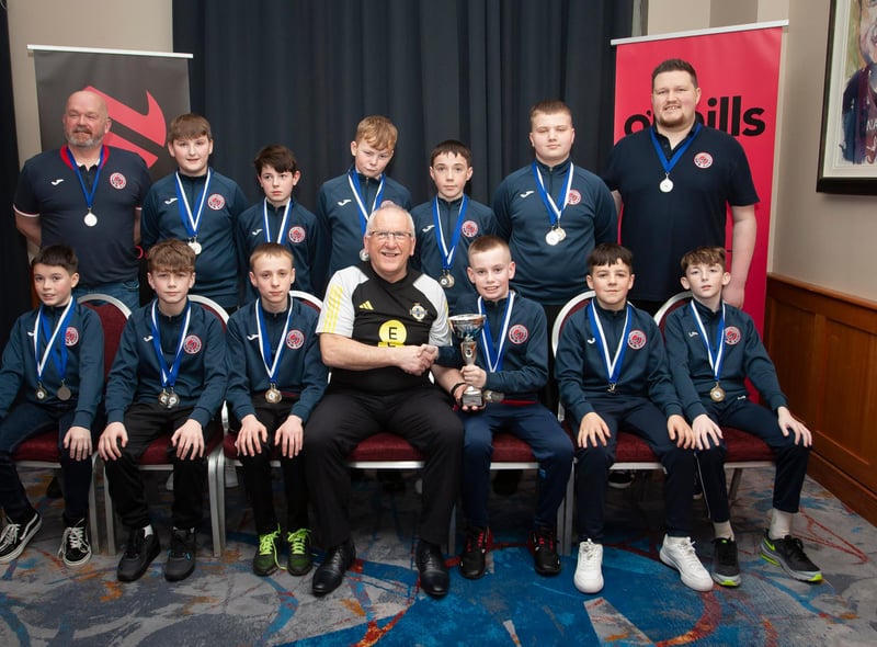 Joe Doherty, IFA Senior Coach, presenting the Under 12 Championship Summer Cup to Clooney FC at the Annual Awards in the City Hotel on Friday night last. Included are coaches Ally Colhoun and Thomas Nelson. (Photo:  Jim McCafferty)