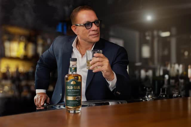 Jean-Claude Van Damme enjoying a glass of Old Oak whiskey.