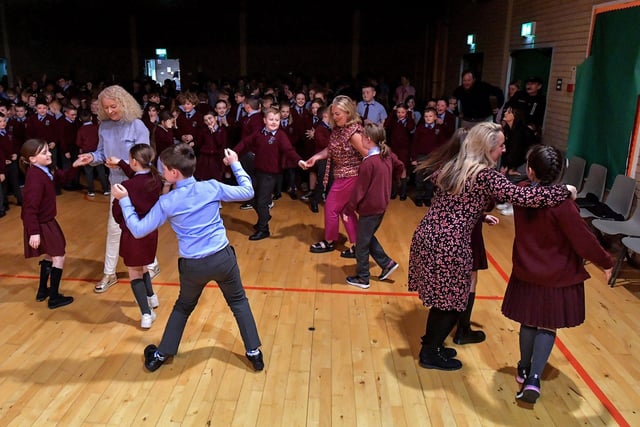 Pupils and staff at St John’s Primary School jive during the Jive Aces performance on Thursday afternoon. Photo: George Sweeney.  DER2317GS – 22