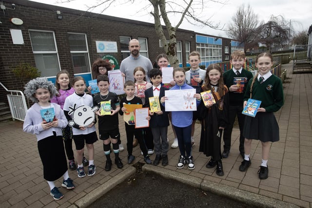 Mr. Kevin Smith pictured at Greenhaw Primary School on Friday with Key Stage 2 World Book Day prizewinners.