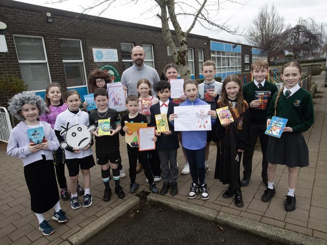 Mr. Kevin Smith pictured at Greenhaw Primary School on Friday with Key Stage 2 World Book Day prizewinners.