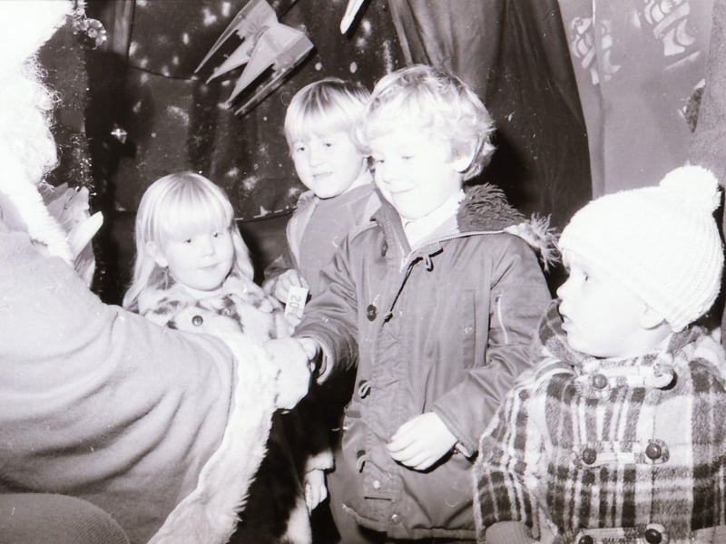 Children meeting Santa Claus at Wellworths shop in Waterloo Place.