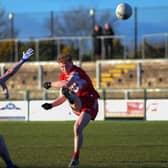 Niall O’Donnell scores a first half point for Derry against Cavan in Owenbeg. Photo: George Sweeney