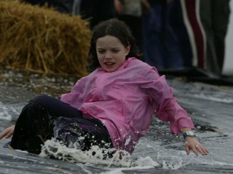Megan McKinney of Lifford making a splash during the warterslide at Cub camp.  (0306JB81)