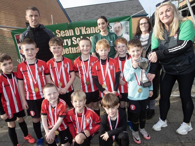 Tristar, winners of the 2024 2017s Sean O’Kane Memorial Cup at St. Joseph’s Boys School on Saturday afternoon receiving their trophy from St. Joseph's Boys School Principal, Mrs. Ciara Deane. .(Photos: Jim McCafferty Photography)
